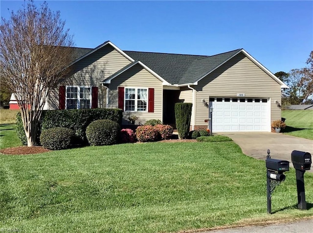 ranch-style house featuring an attached garage, a front lawn, concrete driveway, and roof with shingles