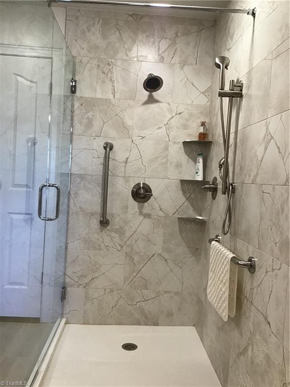 bathroom with a shower stall