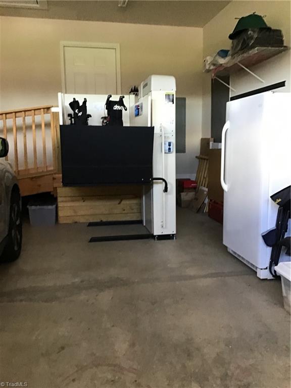 garage with freestanding refrigerator