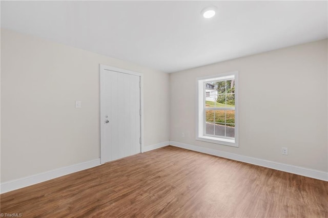 unfurnished room featuring hardwood / wood-style floors