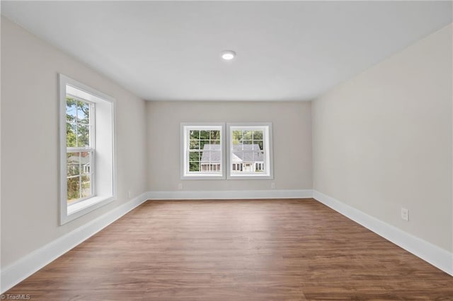 spare room featuring hardwood / wood-style floors