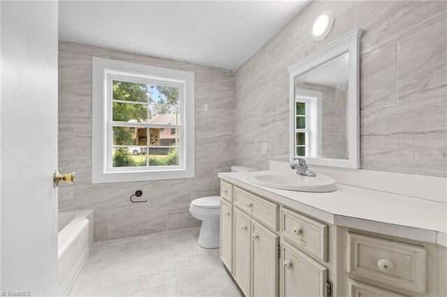 full bathroom with vanity, toilet, tile walls, and shower with separate bathtub