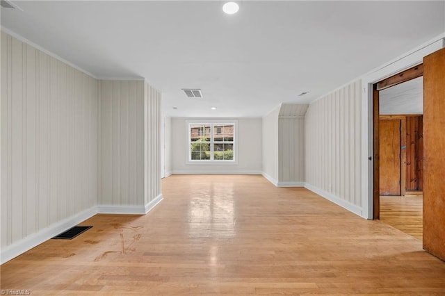 unfurnished room featuring light hardwood / wood-style floors