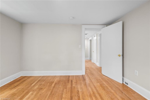 unfurnished room featuring light hardwood / wood-style flooring