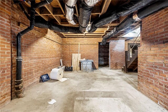 basement with brick wall