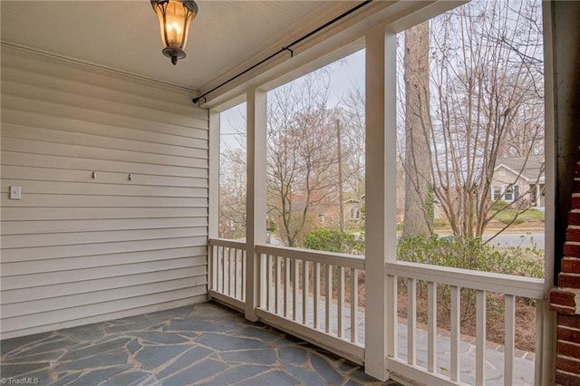 unfurnished sunroom with a healthy amount of sunlight