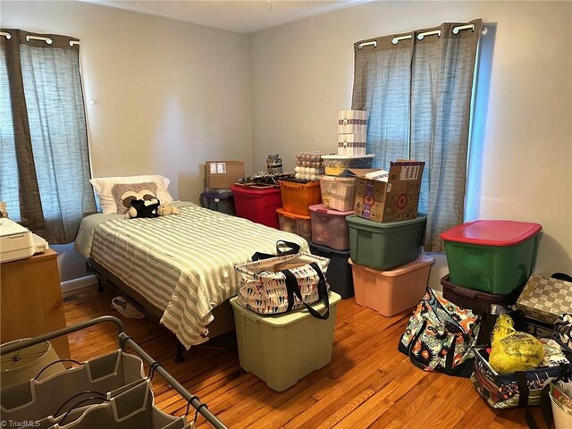 bedroom featuring wood-type flooring