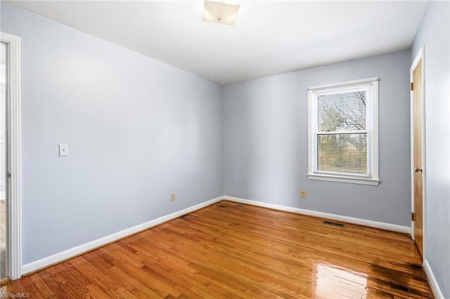 spare room with light wood-type flooring