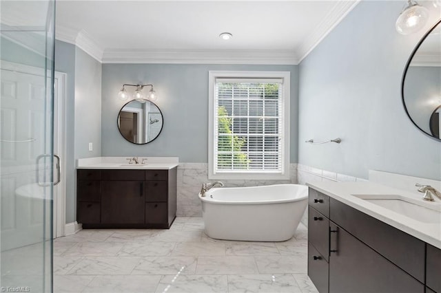 full bathroom with marble look tile flooring, ornamental molding, a freestanding tub, a shower stall, and two vanities