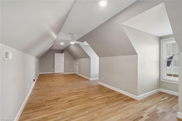 bonus room featuring light wood finished floors, baseboards, vaulted ceiling, recessed lighting, and a ceiling fan