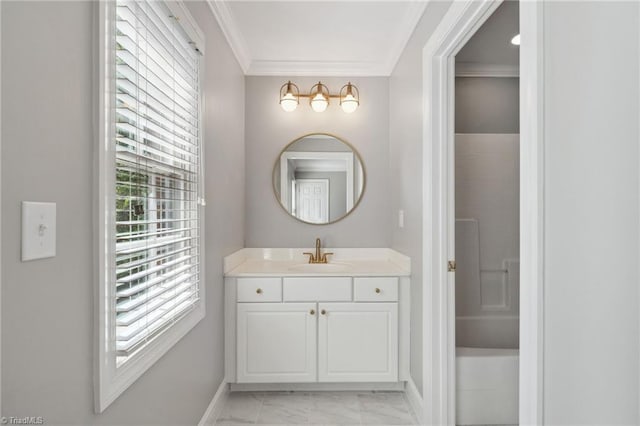 bathroom featuring marble finish flooring, baseboards, vanity, and ornamental molding