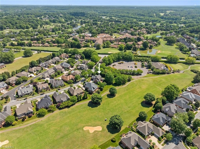 aerial view of residential area featuring a local golf course