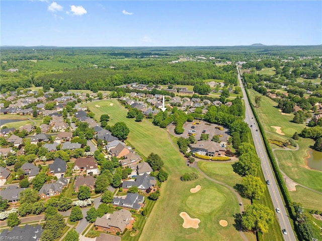 aerial view of property's location with nearby suburban area and a golf course