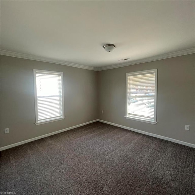 carpeted empty room featuring ornamental molding