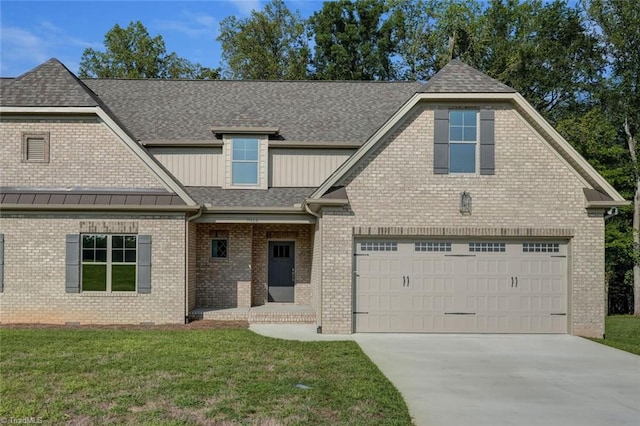 view of front of house featuring a front lawn and a garage