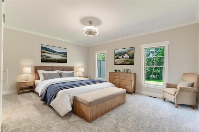 bedroom featuring crown molding and light carpet