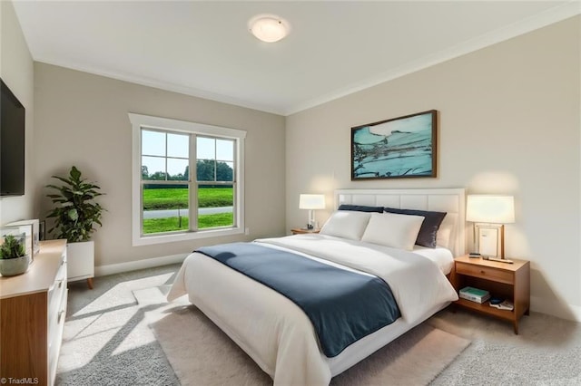 carpeted bedroom with ornamental molding