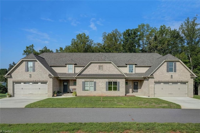 view of front of home with a garage and a front yard