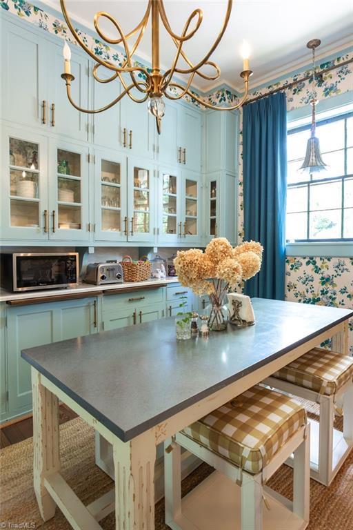 dining area with an inviting chandelier and wood-type flooring