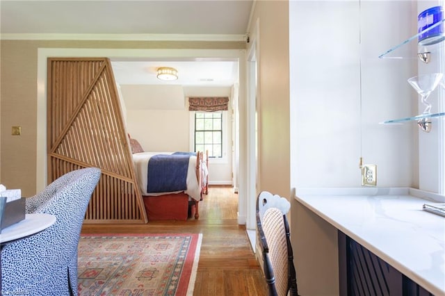 interior space with crown molding and hardwood / wood-style flooring