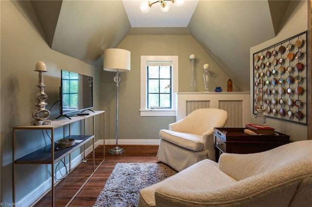 sitting room featuring lofted ceiling and dark hardwood / wood-style floors