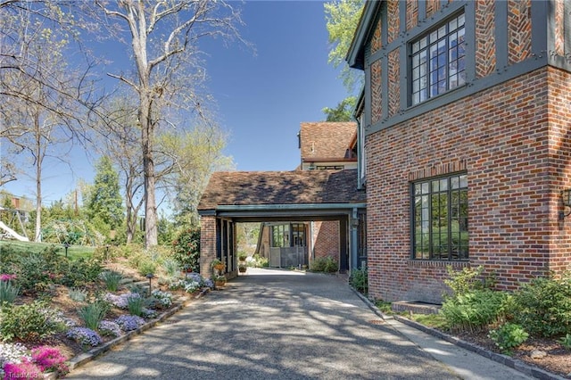 view of side of property featuring a carport