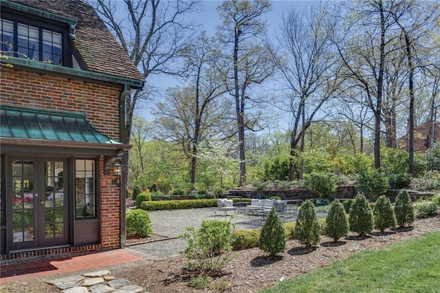 view of yard with a patio and french doors