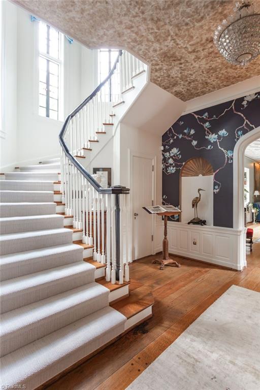 stairs featuring wood-type flooring