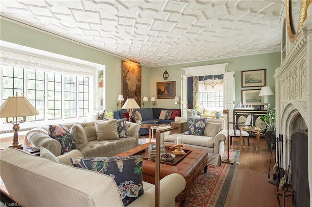 living room featuring ornamental molding and dark hardwood / wood-style flooring