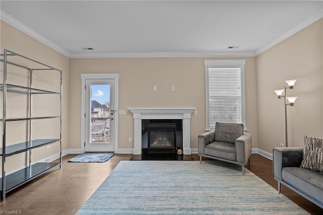 living room with hardwood / wood-style flooring and ornamental molding