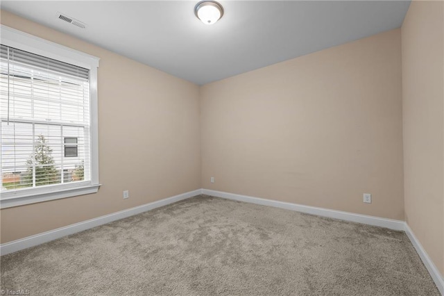 empty room featuring light colored carpet