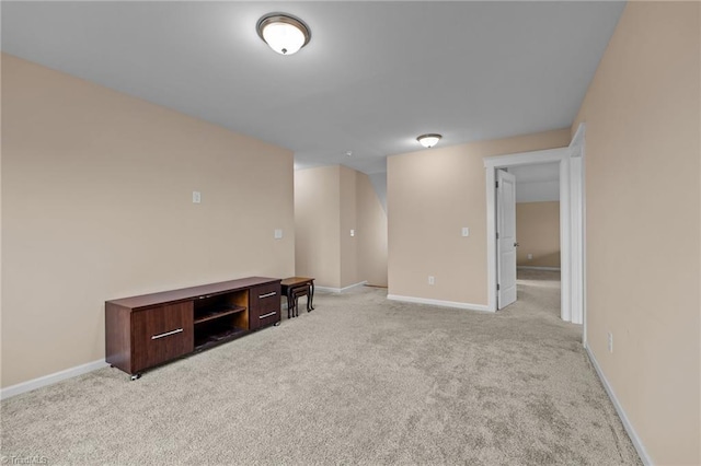 basement featuring light carpet