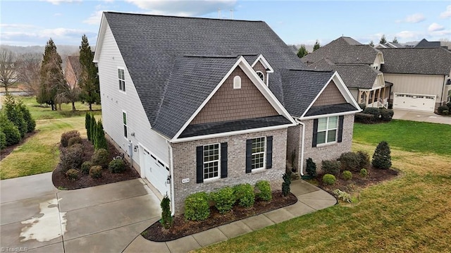 view of front of house featuring a garage and a front yard