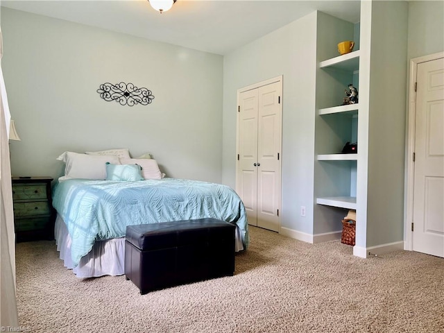 bedroom featuring carpet flooring and baseboards