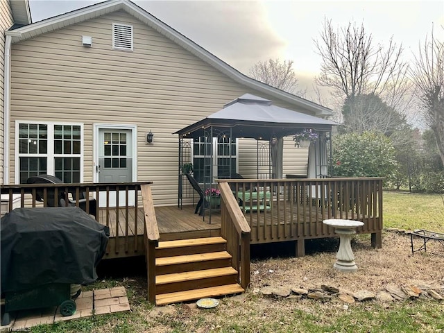 deck with a gazebo and area for grilling