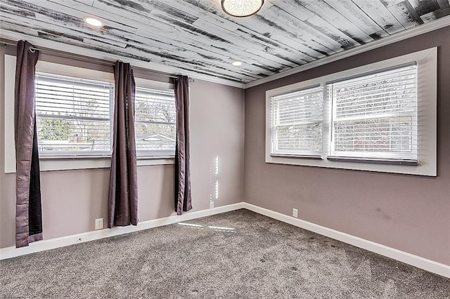 carpeted spare room with ornamental molding, wooden ceiling, recessed lighting, and baseboards