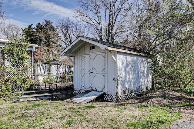 view of shed with fence