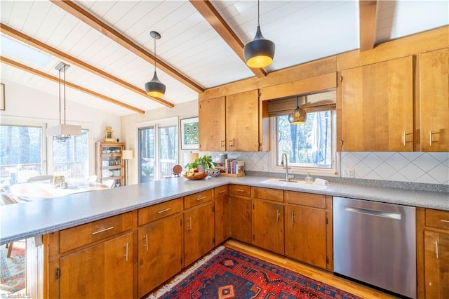 kitchen with hanging light fixtures, vaulted ceiling with beams, sink, stainless steel dishwasher, and tasteful backsplash