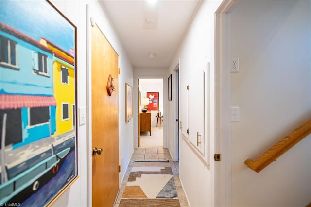 hallway featuring light tile patterned floors