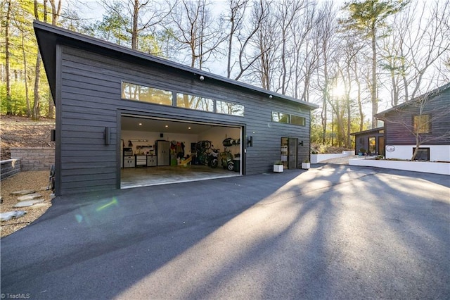 view of property exterior with a garage