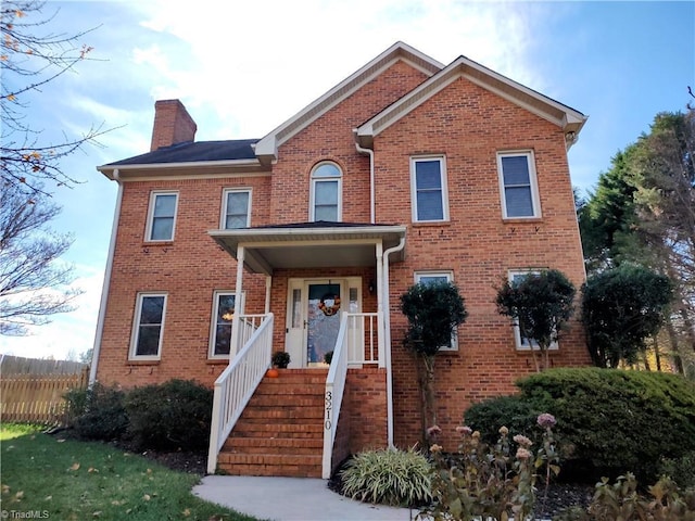 3210 Clamoor Dr, Winston-Salem, NC 27127 - view of front of house with a chimney and brick siding