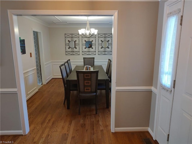 3210 Clamoor Dr, Winston-Salem, NC 27127 - dining space with a chandelier, ornamental molding, wood finished floors, and plenty of natural light