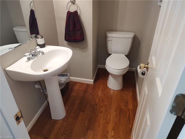 3210 Clamoor Dr, Winston-Salem, NC 27127 - half bath featuring toilet and wood finished floors