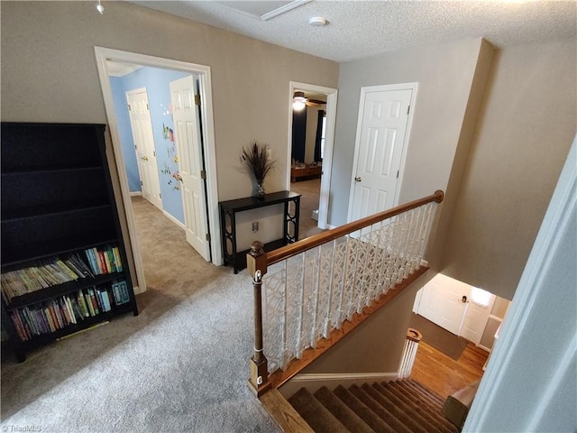 3210 Clamoor Dr, Winston-Salem, NC 27127 - stairs featuring carpet floors and a textured ceiling