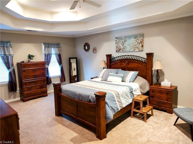3210 Clamoor Dr, Winston-Salem, NC 27127 - bedroom featuring light carpet, a raised ceiling, and a ceiling fan