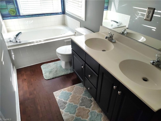 3210 Clamoor Dr, Winston-Salem, NC 27127 - bathroom with wood finished floors, a garden tub, and double vanity