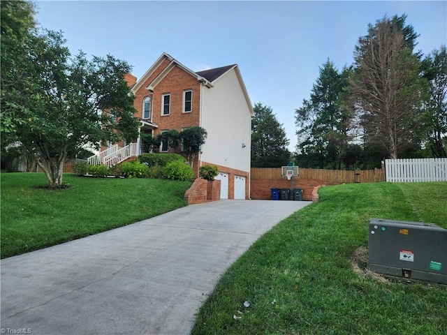 3210 Clamoor Dr, Winston-Salem, NC 27127 - view of home's exterior with a garage, brick siding, and concrete driveway