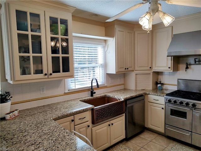3210 Clamoor Dr, Winston-Salem, NC 27127 - kitchen with gas stove, dishwasher, wall chimney range hood, a ceiling fan, and backsplash