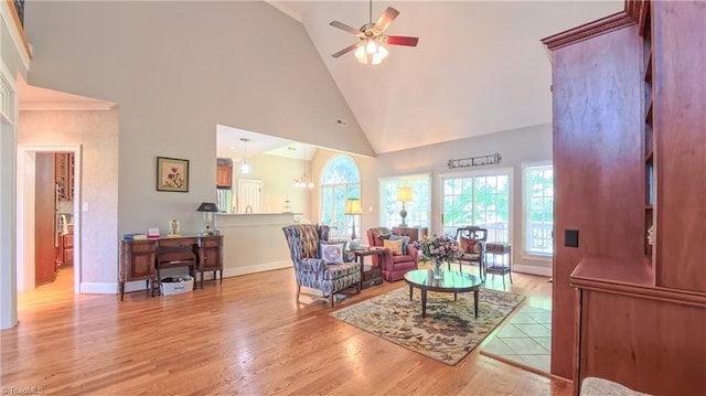 1250 Whitworth Ct, Kernersville, NC 27284 - living room with high vaulted ceiling, ceiling fan, and light wood-style floors