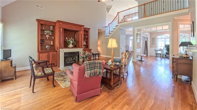 1250 Whitworth Ct, Kernersville, NC 27284 - living room with high vaulted ceiling, a fireplace, and light wood finished floors